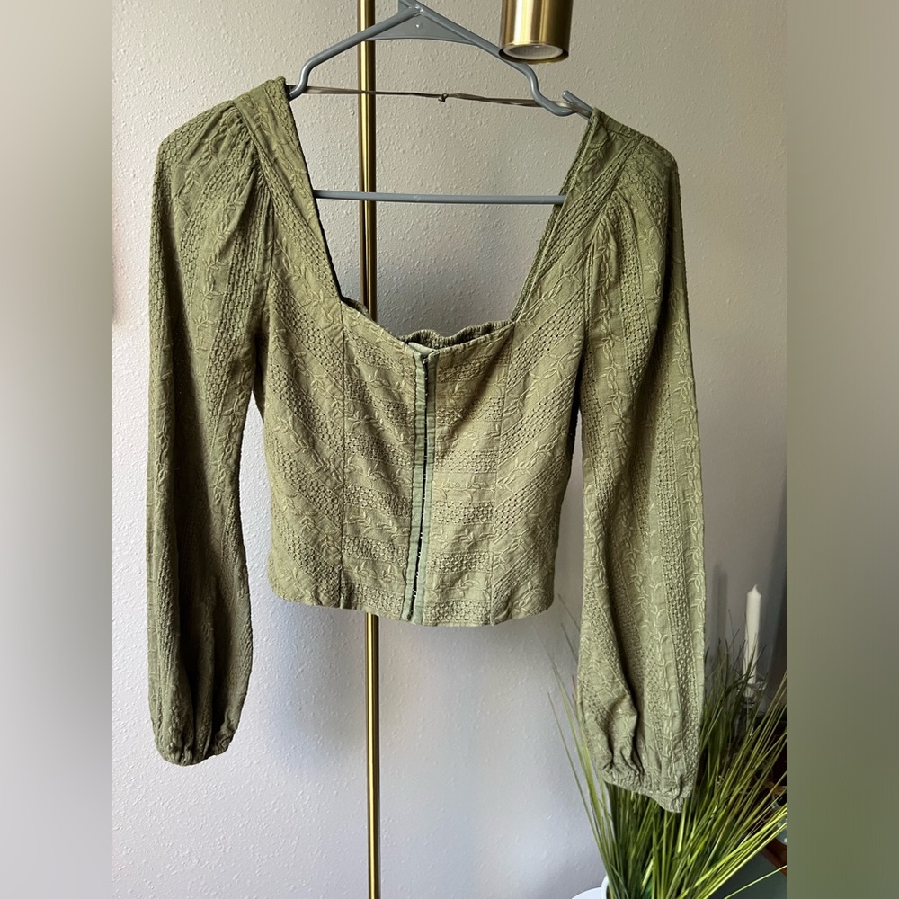 Green, eyelet corset top with puffy sleeves by Altar’d State